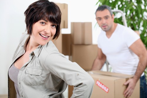 Removal team handling furniture during Docklands flat move